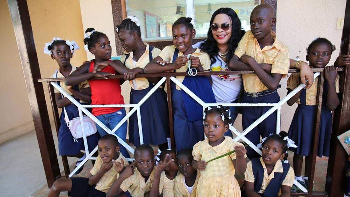 Judith Joseph, founder of the non-profit Catwalk for Charity, with students from Ecole Nouvelle Zoranje in Port-au-Prince in July, 2018. Her charity has an annual fashion show in Miami to raise money for various organizations in Haiti, including PRODEV, which is an education nonprofit that created the school.