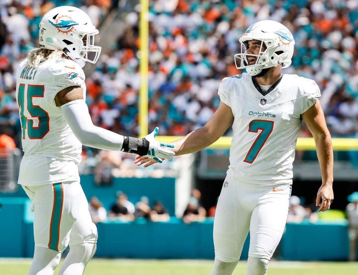 Miami Dolphins place kicker Jason Sanders (7) Duke Riley (45) celebrate after Sanders kicks an extra point in the first half against the Denver Broncos and Miami Dolphins at Hard Rock Stadium in Miami Gardens on Sunday, September 24, 2023.