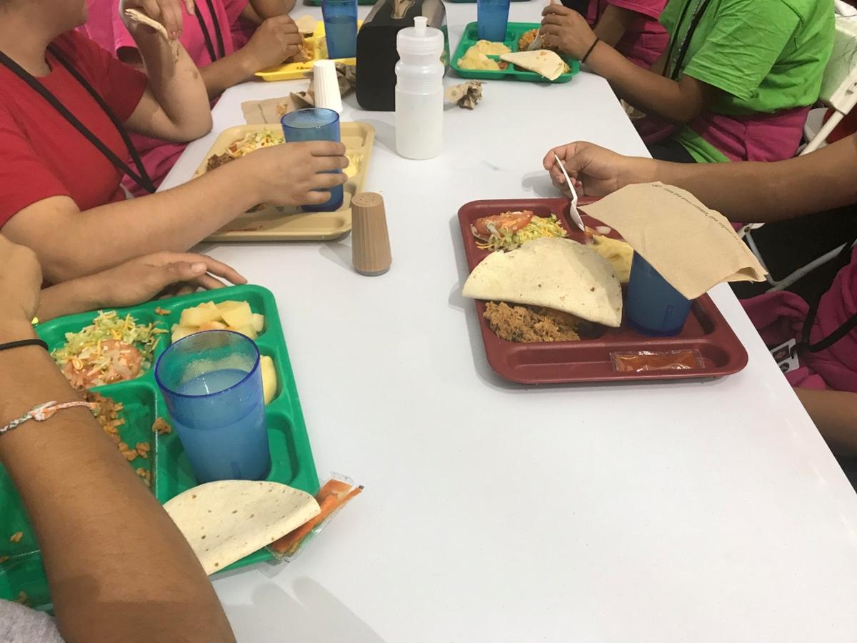 It takes about two hours for all 1,200 children in the Homestead Temporary Shelter for Unaccompanied Children to cycle through the dining room each meal.