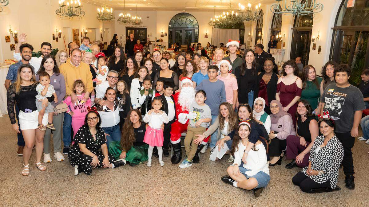 Refugee Assistance Alliance volunteers and clients as a holiday party.