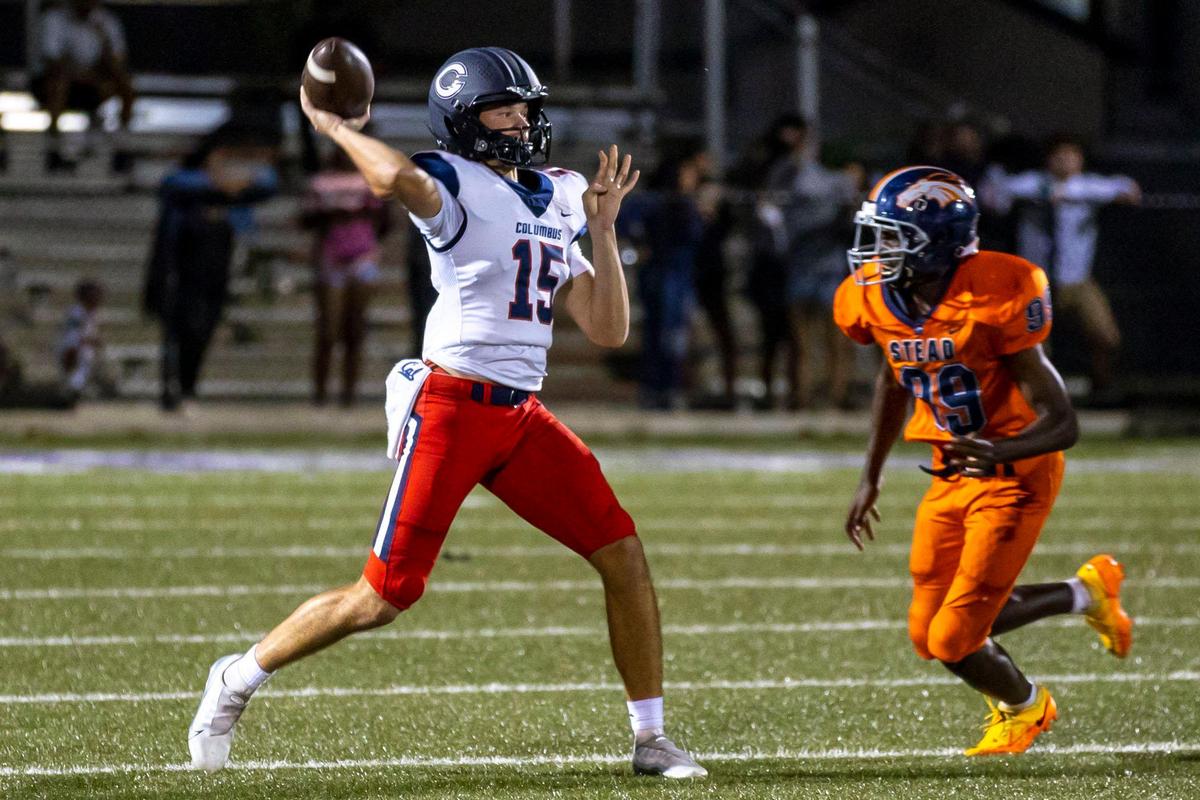 Columbus quarterback Alberto Mendoza (15) throws the ball while chased by Homestead defensive end Jerry Kavaursea (99) during the first half of a high school football game at Harris Field Stadium in Homestead, Florida, on Friday, October 7, 2022.