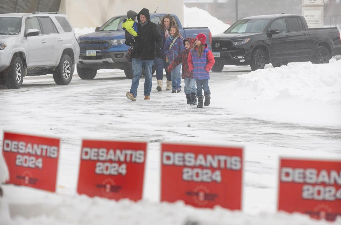Supporters of Florida Gov. Ron DeSantis arrive to the Never Back Down super PAC headquarters before the start of a political rally on Saturday, Jan. 13, 2024, in West Des Moines, Iowa. DeSantis, who is campaigning across Iowa, is running for the Republican presidential nomination.