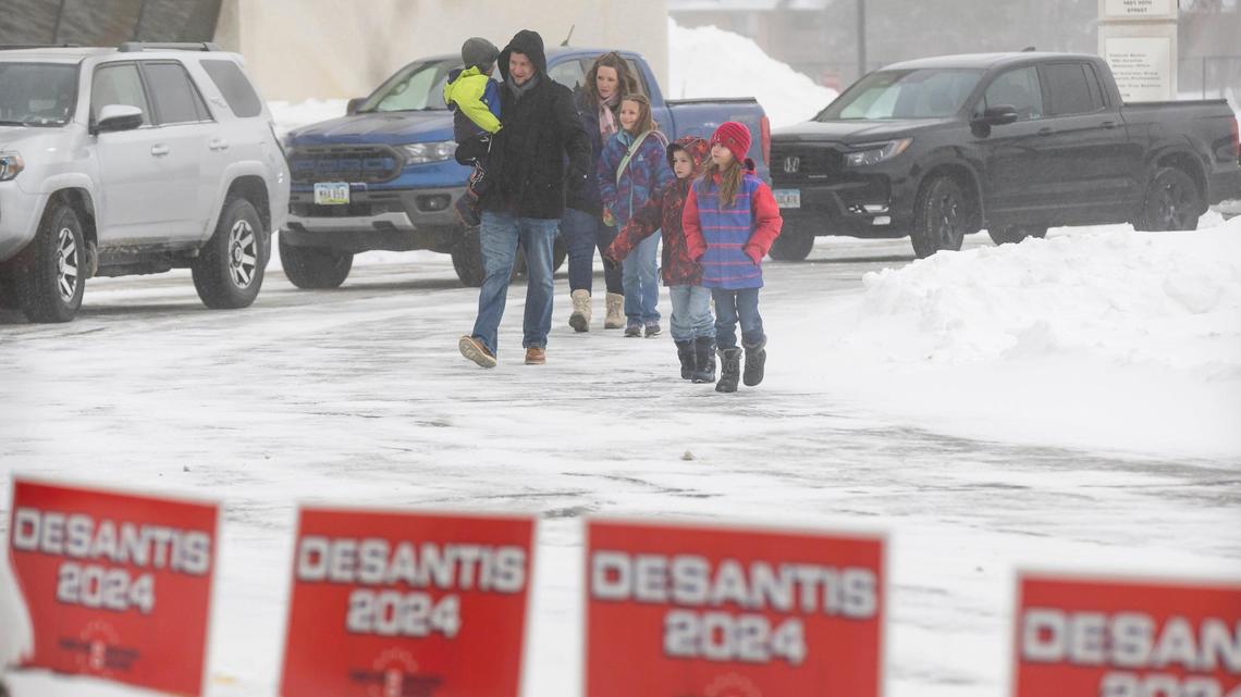 Supporters of Florida Gov. Ron DeSantis arrive to the Never Back Down super PAC headquarters before the start of a political rally on Saturday, Jan. 13, 2024, in West Des Moines, Iowa. DeSantis, who is campaigning across Iowa, is running for the Republican presidential nomination.