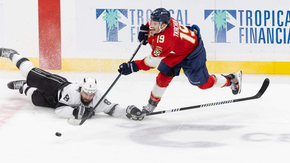 Florida Panthers left wing Matthew Tkachuk (19) shoots toward the goal to score as Los Angeles Kings defenseman Drew Doughty (8) defends in the third period of their NHL game at Amerant Bank Arena on Wednesday, Jan. 29, 2025, in Sunrise, Fla.