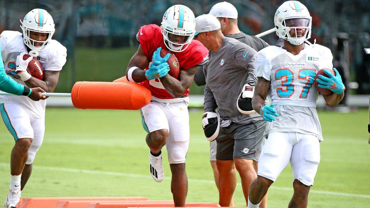 Miami Dolphins running backs Myles Gaskin (37) and Salvon Ahmed (26) during training camp at the new training camp facility at Hard Rock Stadium in Miami Gardens, Florida, August 4, 2021.