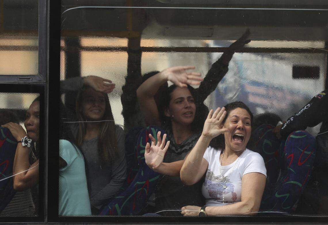 Political prisoners wave in jubilation before their release from the Helicoide prison in Caracas, Venezuela, on June 1, 2018.