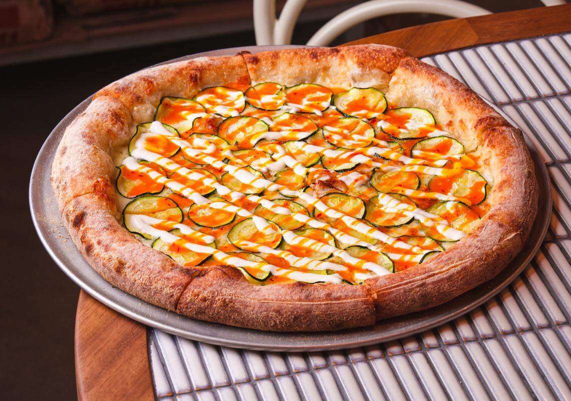 A zucchini pizza at Bar Bucce, with mozzarella, Calabrese chili, caprino, egg jam and no sauce.