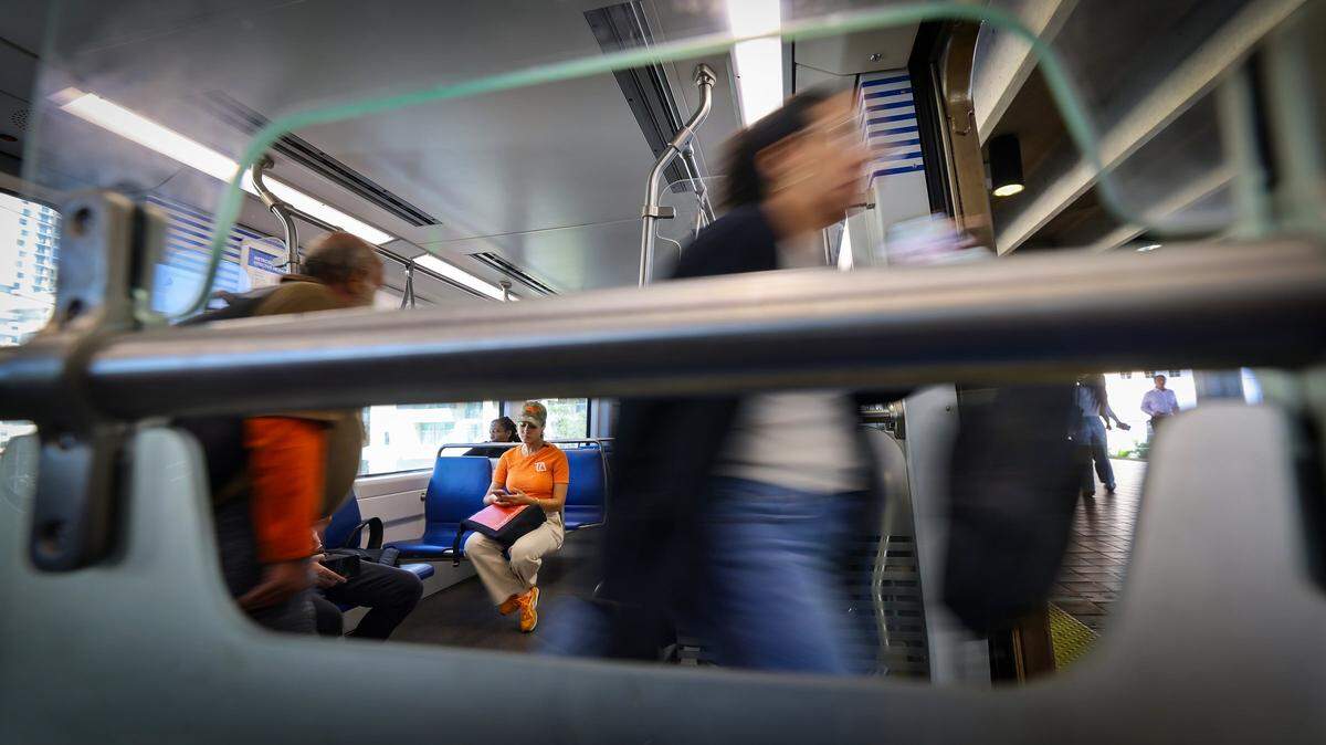 10:23 AM - Executive director of Transit Alliance Miami, Cathy Dos Santos, takes the Soundbound Metrorail and keeps in contact with her office. Today her journey from home to her office took over an hour and a half using multiple modes of transit on Tuesday, September 30, 2025 in Miami-Dade, Florida.