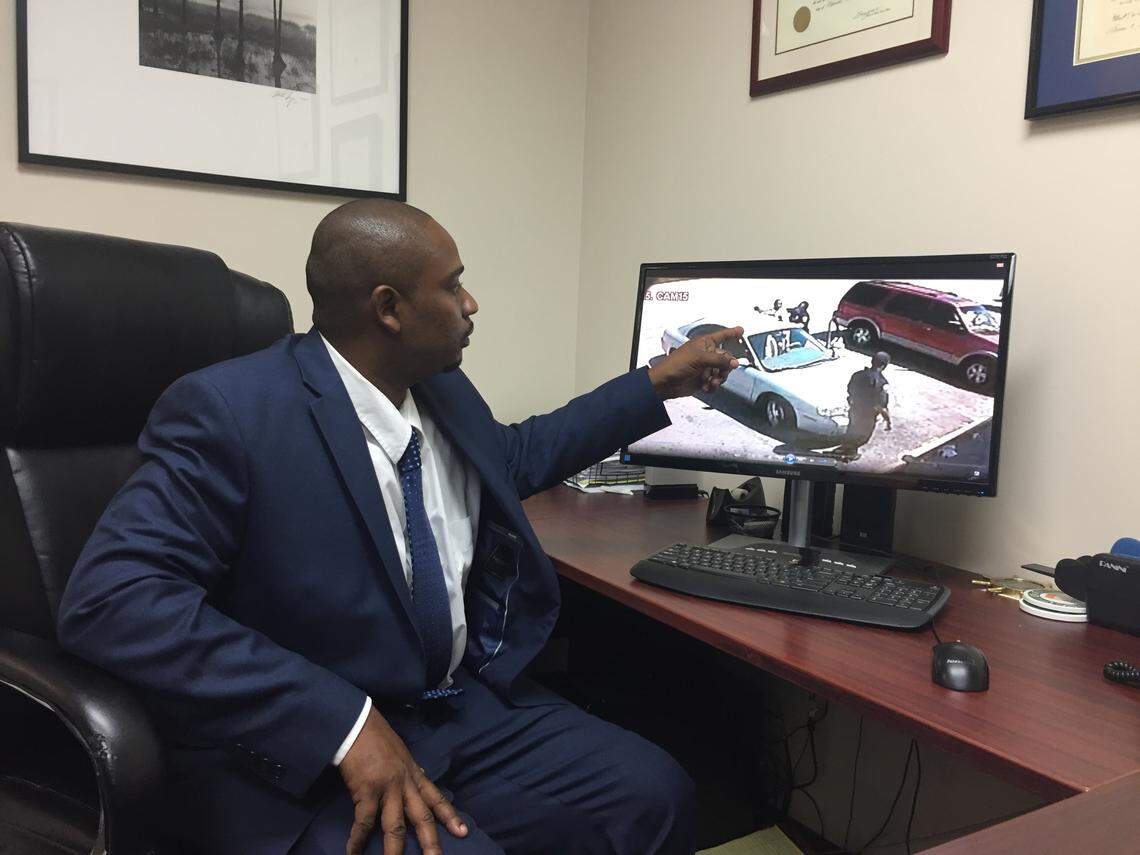 Warren Rollins points to a video of his altercation with Hollywood Police Officer Alfred Stabile, whom he accuses in a lawsuit of grabbing him by the neck and slamming him to the ground outside a convenience store in 2012.