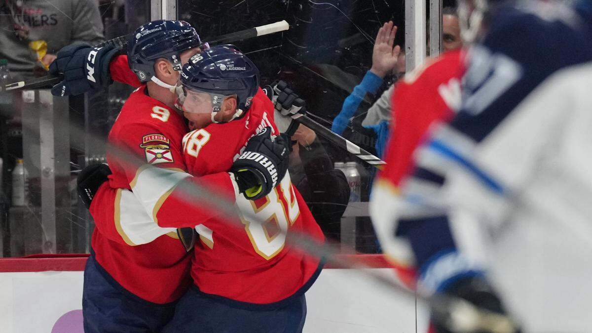 Nov 16, 2024; Sunrise, Florida, USA; Florida Panthers defenseman Nate Schmidt (88) celebrates with center Sam Bennett (9) after a goal against the Winnipeg Jets during the second period at Amerant Bank Arena. Mandatory Credit: Jim Rassol-Imagn Images