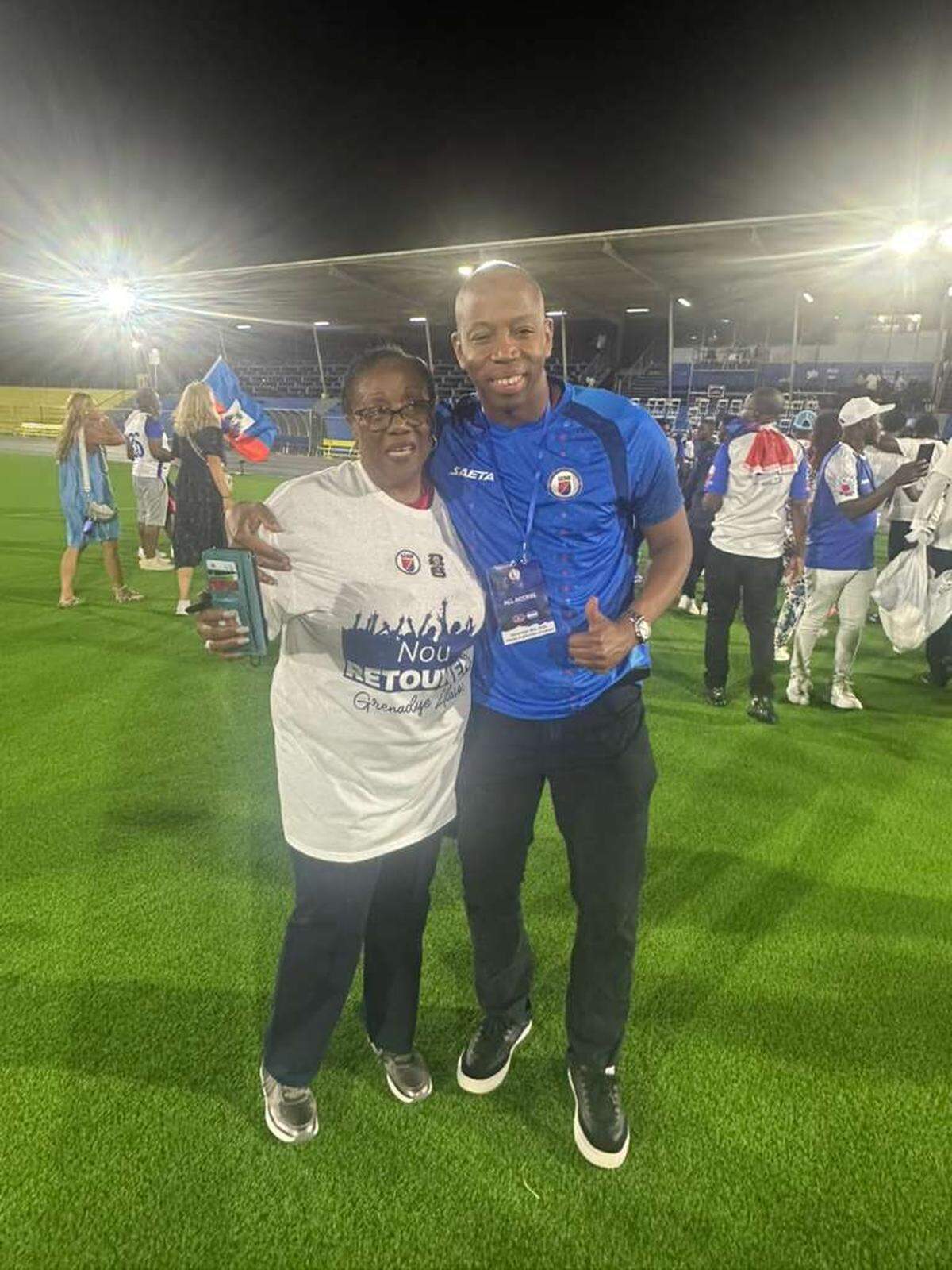 Dr. Joseph Durandis and Monique Andre, head of the Haitian soccer Federation on the field in Curaçao after Haiti qualified for the World Cup for the first time since 1974 with a 2-0 win over Nicaragua.