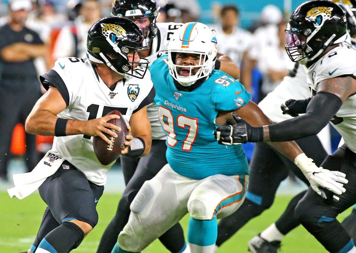 Miami Dolphins defensive tackle Christian Wilkins (97) eyes Jacksonville Jaguars quarterback Gardner Minshew (15) during a preseason game. Wilkins has had mixed results so far in his rookie season.