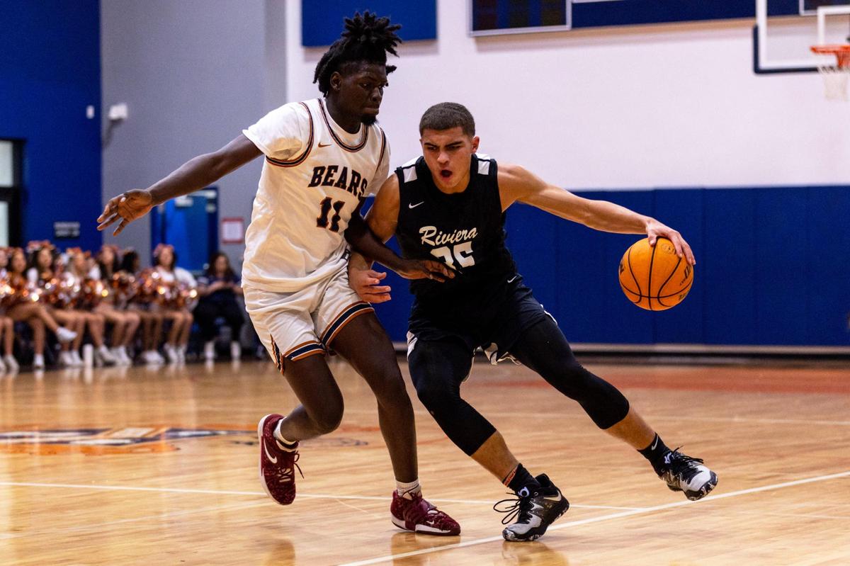 Riviera Prep forward Dante Allen (35) drives on Mater Lakes forward Rolph Blanc (11) during a high school basketball game at Mater Lakes High School in Hialeah, Florida, on Wednesday, January 18, 2023.