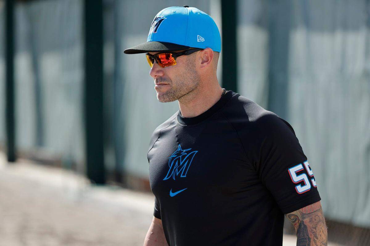 Miami Marlins manager Skip Schumaker joins the team on the field during Miami Marlins pitchers and catchers’ spring training workout at Roger Dean Chevrolet Stadium in Jupiter, Florida on Thursday, February 15, 2024.