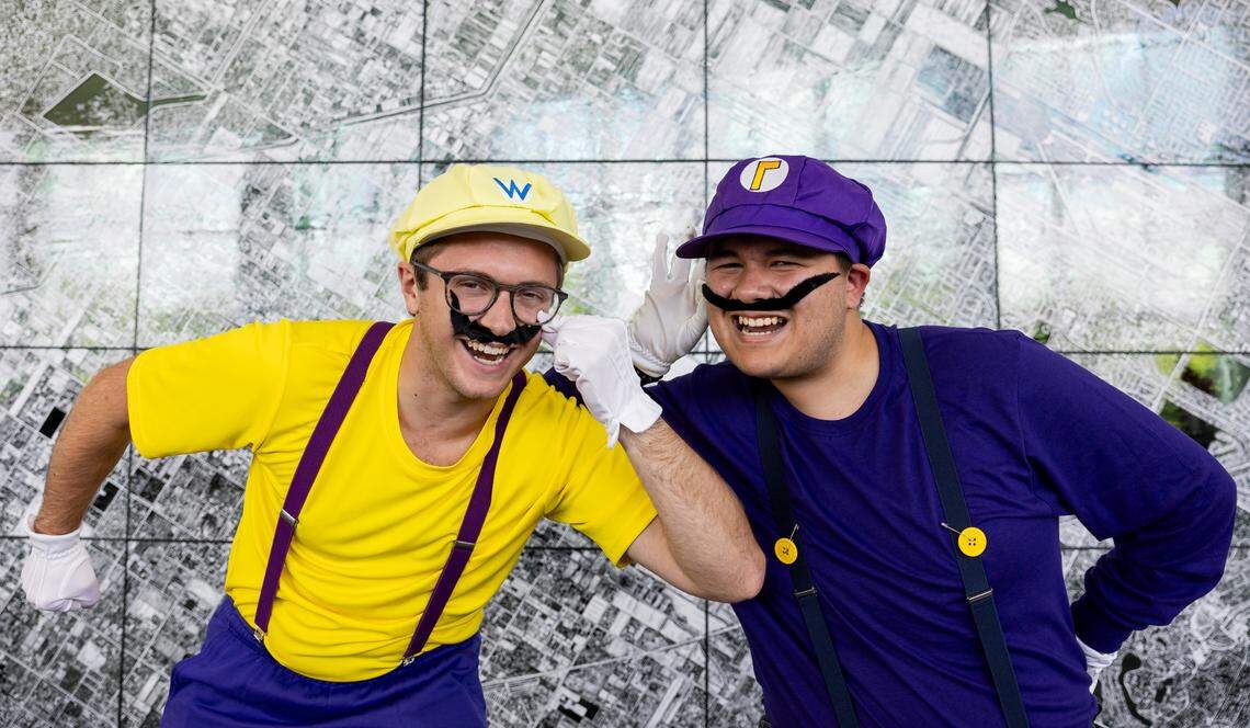 Brad Pierce, 24, as Wario and Jude Alejo, 18, as Waluigi, cosplay as characters from the Super Mario series during Florida Supercon 2024 at the Miami Beach Convention Center on Saturday, July 13, 2024, in Miami Beach, Fla.