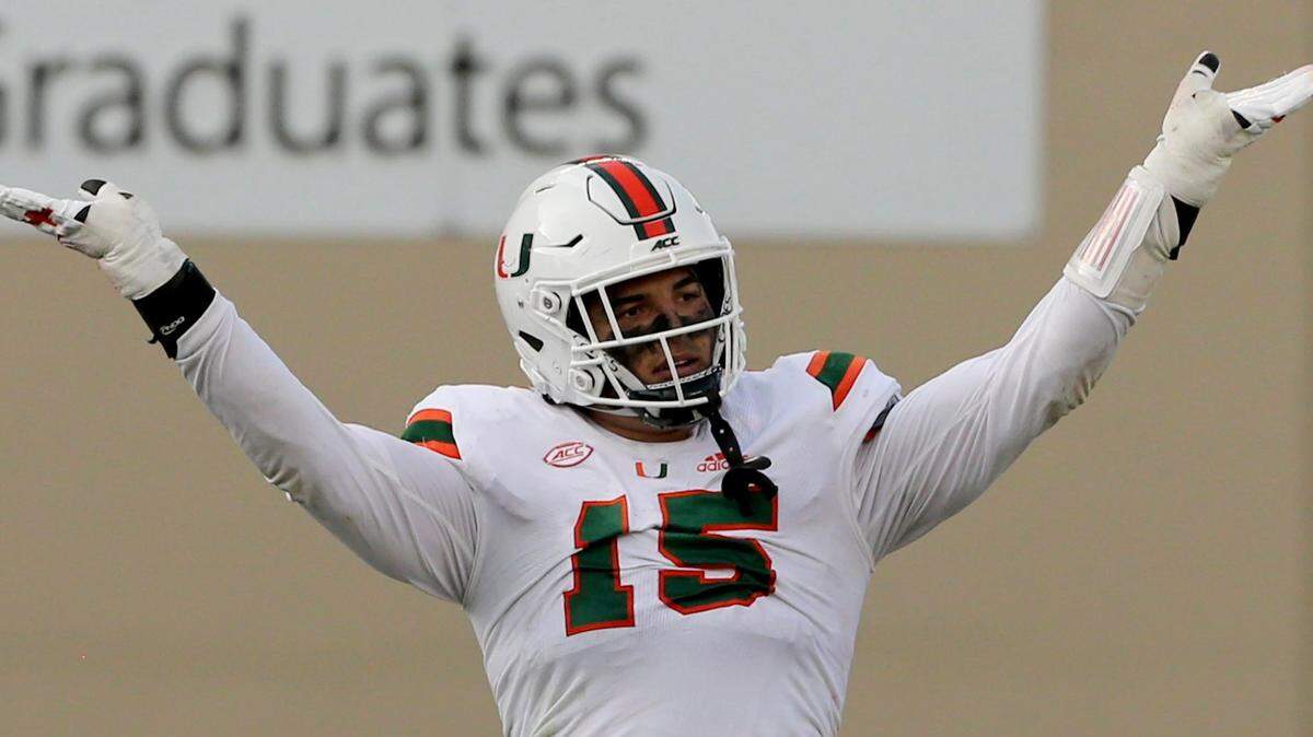 Miami’s 15 Jaelan Phillips celebrates a defensive stop during the second half of the University of Miami - Virginia Tech NCAA college football game, Saturday, Nov.14 2020, in Blacksburg, Va. Miami won the game 25-24. (AP Photo / MATT GENRTY, The Roanoke Times, Pool)