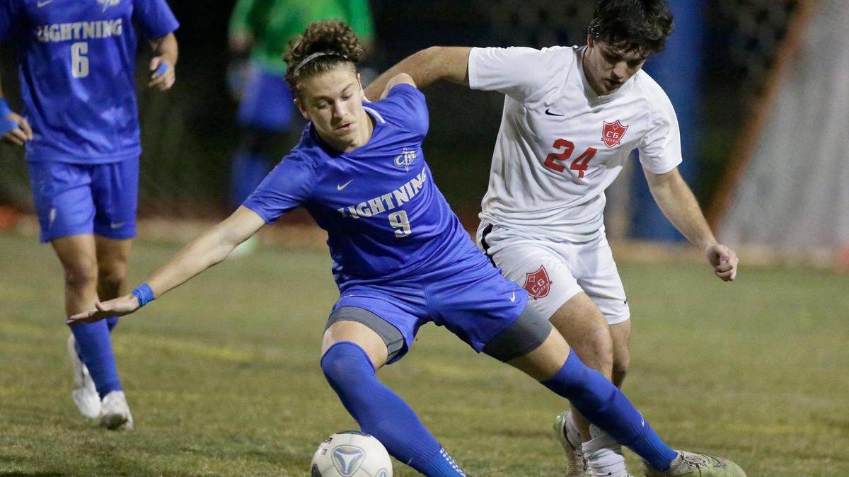 Cypress Bay’s Rafael Piazzi (9) takes control of the ball while Coral Gables Dante Mailhofer (24) challenges him during the Region 4-7A boys’ soccer semifinal on Friday, February 16, 2024 at Cypress Bay HS in Weston.