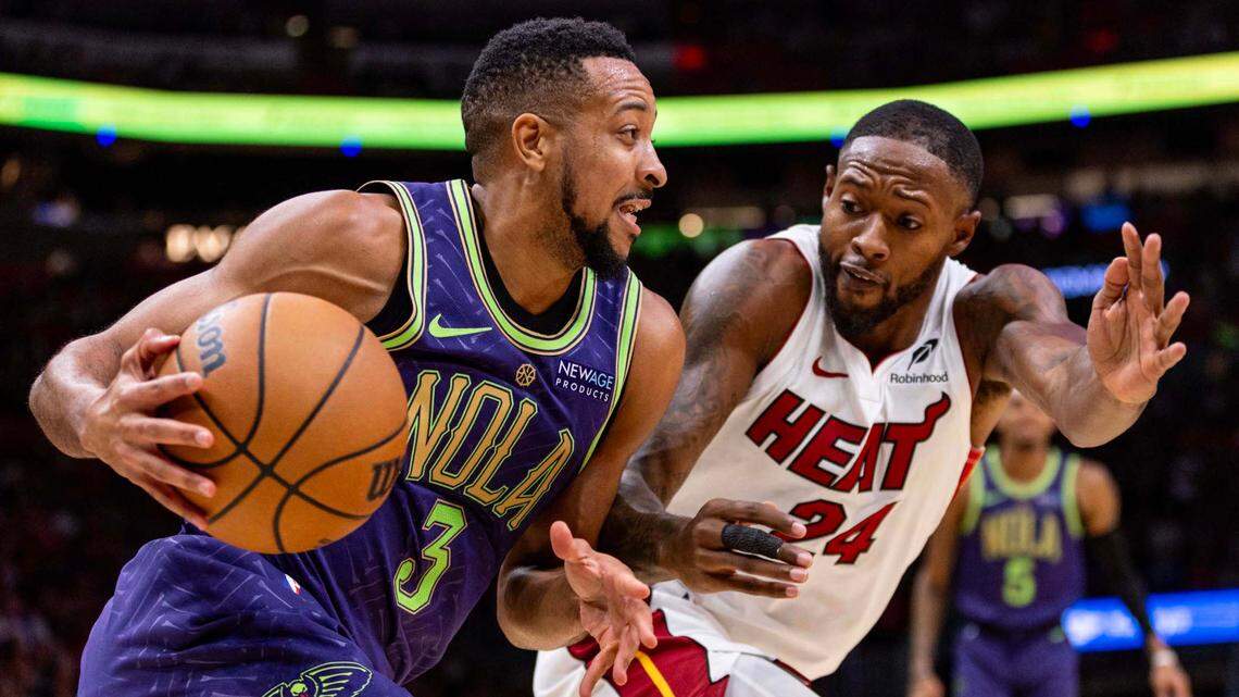 New Orleans Pelicans guard CJ McCollum (3) drives toward the paint on Miami Heat forward Haywood Highsmith (24) during the second quarter of an NBA game at Kaseya Center on January 1, 2025, in Miami.