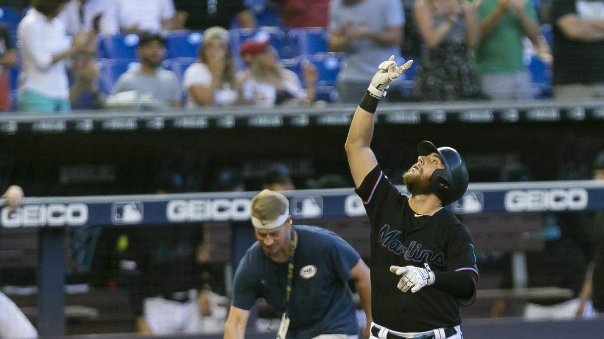 Miami Marlins right fielder Austin Dean (44) reacts after hitting a home run in the third inning of a baseball game at Marlins Park in Miami on Saturday, April 13, 2019.