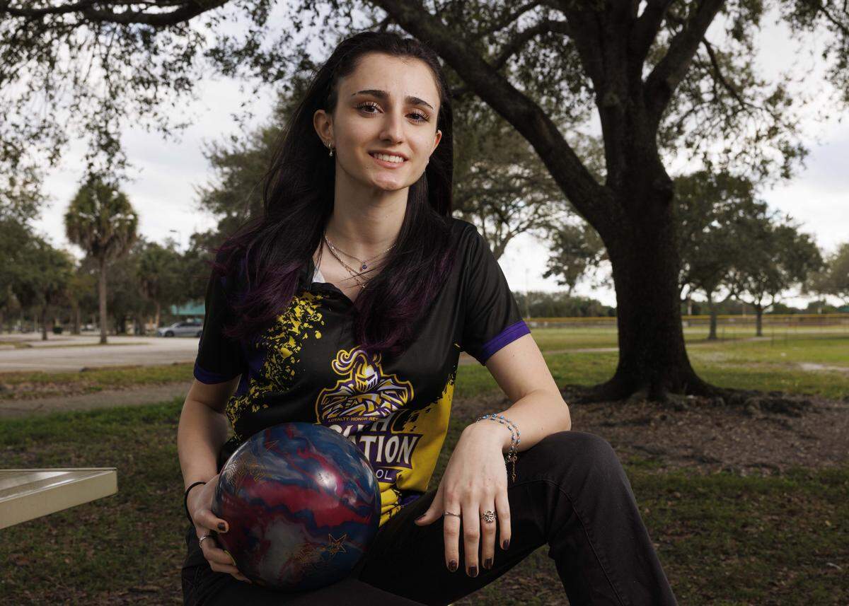 Sofia Montefusco, bowler of the year from South Plantation, poses with her ball during a photoshoot with the Miami Herald on Wednesday, Jan. 14, 2026, at Brian Piccolo Park in Hollywood, Fla.