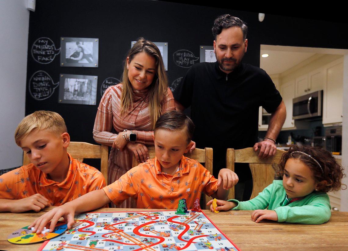 (C) Logan Jenner, 8, former cancer patient at the Nicklaus Children’s Hospital next to his family (L/front) Ashton, 10, brother, (R/Front) Mary, 4, sister; (L/Back) Diana Jenner, 35 mom and (R/Back) Michael Jenner, 38 dad; at their house in Miami-Dade on Monday March 4th., 2024.