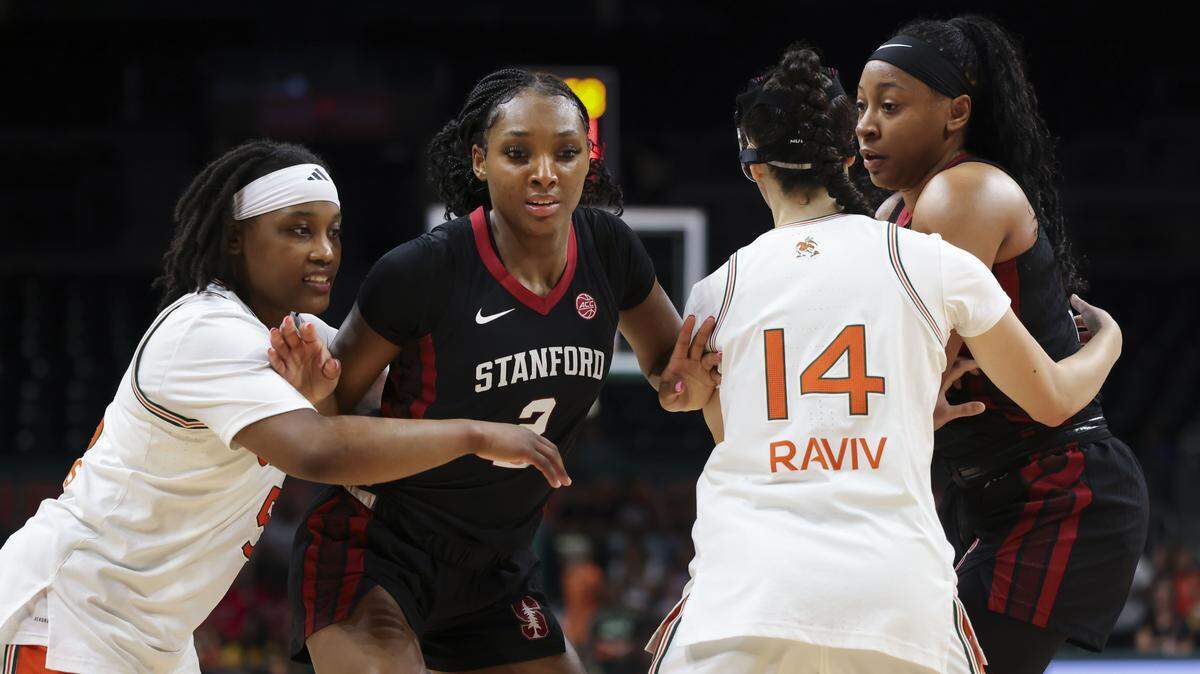 Miami Hurricanes guards Ahnay Adams (5) and Gal Raviv (14) run a full court press defense against Stanford Cardinal guards Hailee Swain (2) and Chloe Clardy (13) during the first half of a game on Thursday, Feb. 19, 2026, at Watsco Center in Coral Gables, Fla.