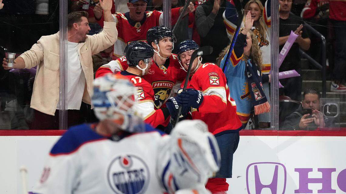 Nov 20, 2023; Sunrise, Florida, USA; Florida Panthers defenseman Niko Mikkola (77) celebrates his goal against the Edmonton Oilers with teammates on the ice during the second period at Amerant Bank Arena. Mandatory Credit: Jasen Vinlove-USA TODAY Sports