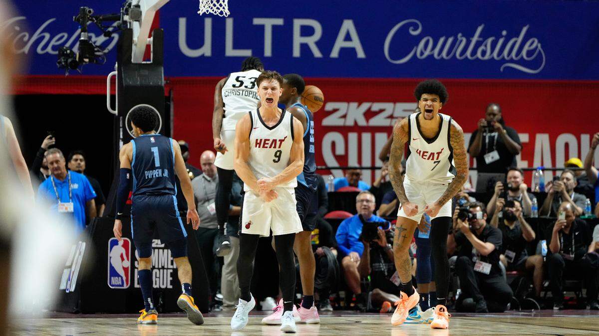 Miami Heat guard Pelle Larsson (9) reacts with center Kel’el Ware (7) after scoring against the Memphis Grizzlies during the overtime at Thomas & Mack Center.