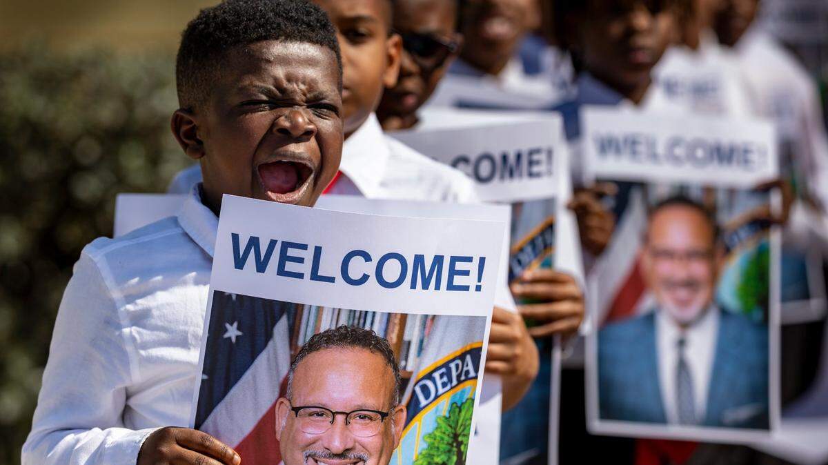 Jeremiah Johnson, a third grader at Dr. Frederica Wilson / Skyway Elementary School, yawns as he and his fellow classmates rehearse for the welcoming of Secretary of Education Miguel Cardona in Miami, Florida, on May 4, 2023. U.S. Secretary of Education Miguel Cardona and U.S. Congresswoman Frederica S. Wilson held a roundtable discussion with local edu leaders at the school.