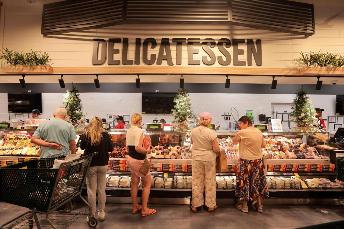 Customers shop for deli meats at NetCost Market in Hollywood, Florida, on Thursday, Dec. 19, 2024.