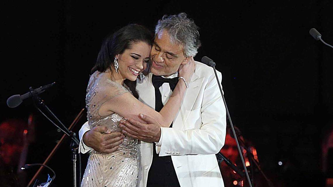 Andrea Bocelli and Soprano Maria Aleida Rodriguez hug each other at the end of their performance, with the Miami Symphony Orchestra during the Hard Rock Rising Miami Beach, Global Music Festival, celebrating the 100th Birthday of the City of Miami Beach, on Thursday March 26, 2015.