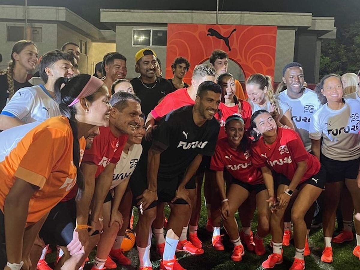 Inter Miami forward and Uruguayan legend Luis Suarez spent Wednesday evening Dec. 3, 2025, in Little Havana with local players from the ABFC club at the Pulisic Stomping Grounds as part of a Puma promotion. In red, to Suarez’s left, are NWSL players Lilly Reade and Kimmi Ascanio.