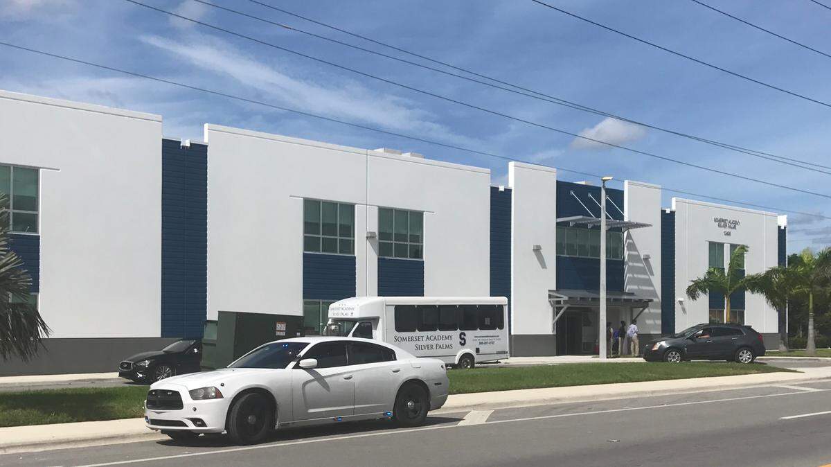 An unmarked police car is parked in front of Somerset Academy Silver Palms High School at Southwest 248th Street on Wednesday, Sept. 4, 2019.