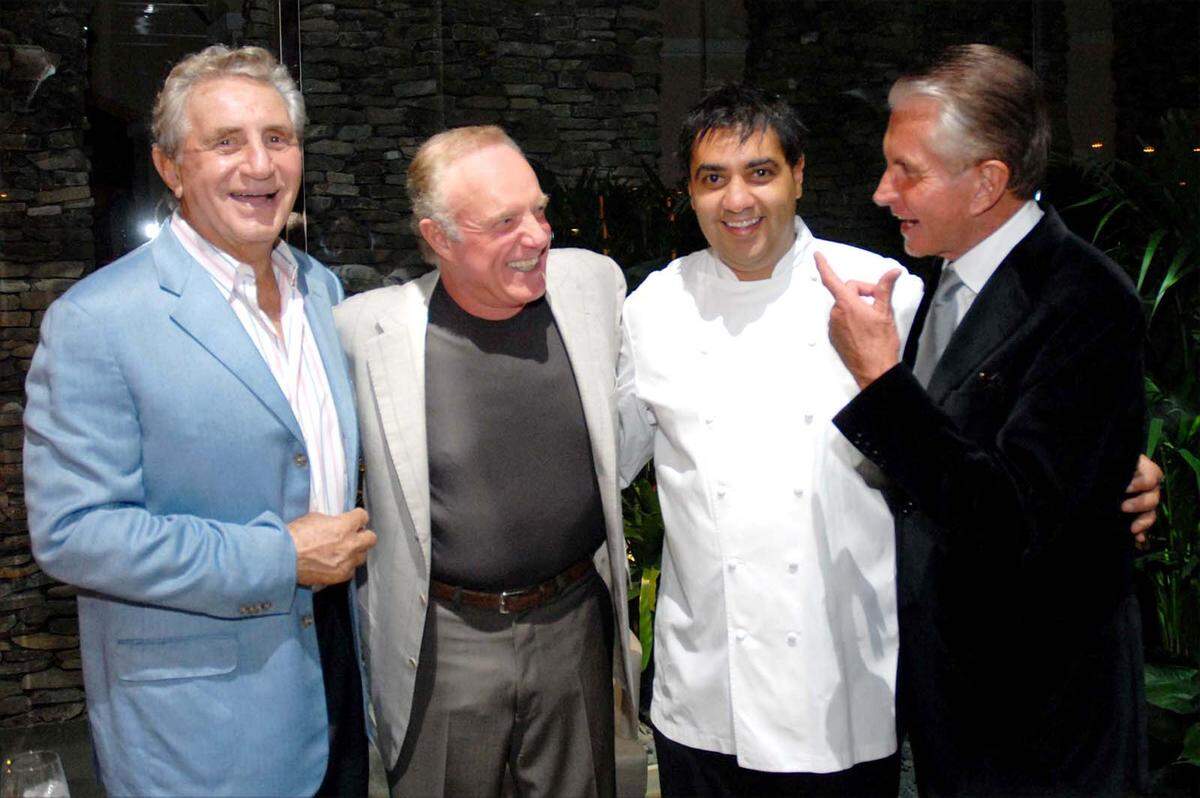 In this file photo from Nov. 26, 2013, Don Soffer (left) is seen at Bourbon Steak at Turnberry Isle with James Caan, Michael Mina and “Where the Boys Are” actor George Hamilton.