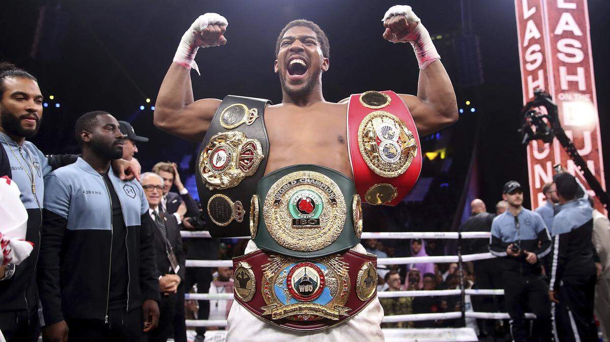 Britain’s Anthony Joshua celebrates after beating Andy Ruiz Jr. on points to win their World Heavyweight Championship contest at the Diriyah Arena, Riyadh, Saudi Arabia early Sunday Dec. 8, 2019. (Nick Potts/PA via AP)