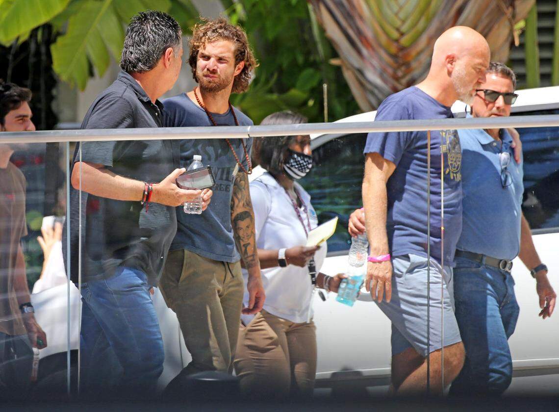 Families of the missing and the dead return from visiting the site of the Champlain Towers South condo building collapse in Surfside, Florida.
