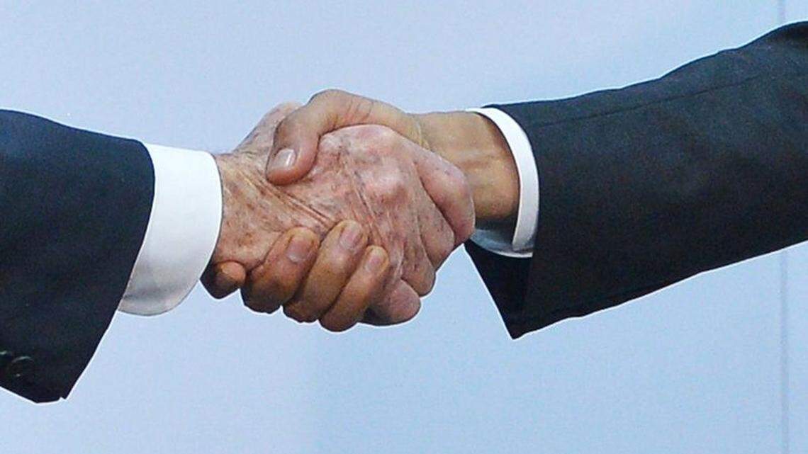President Obama, right, shakes hands with Cuba’s President Raul Castro during the Summit of the Americas in Panama City in 2015.