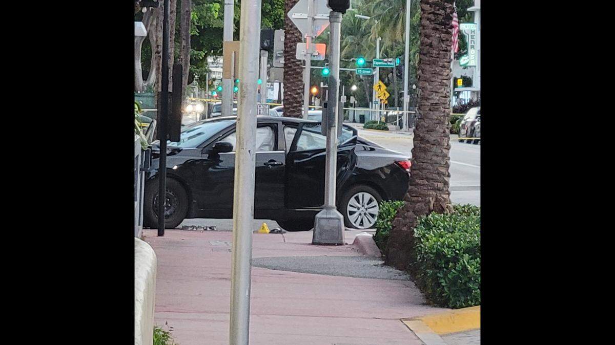 The sedan in which Miami Beach police found a man shot dead around 3 a.m., Thursday, June 30, had crashed into a traffic signal pole at the South Beach corner of Collins Avenue and 14th Street.