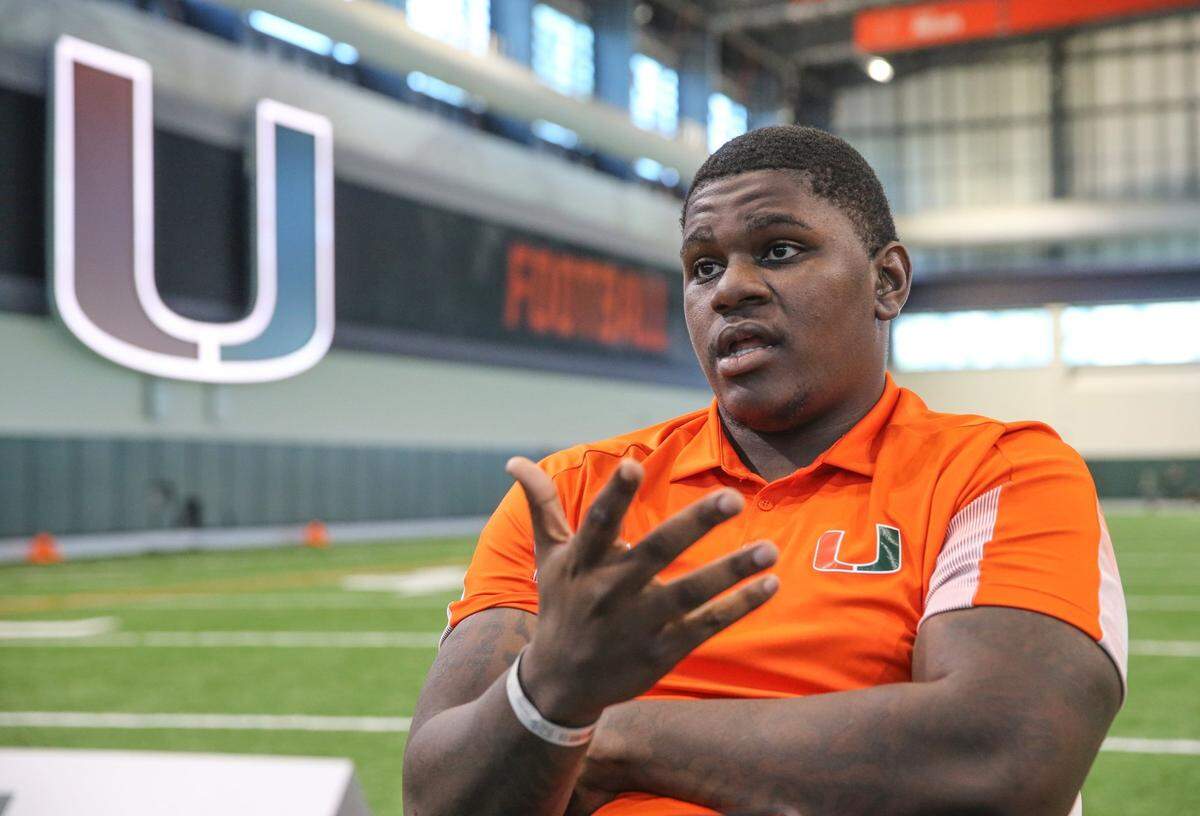 Miami Hurricanes offensive lineman John Campbell, Jr. (74) speaks to reporters during Media Day in the Carol Soffer Indoor Practice Facility at the University of Miami on Tuesday, August 2, 2022.