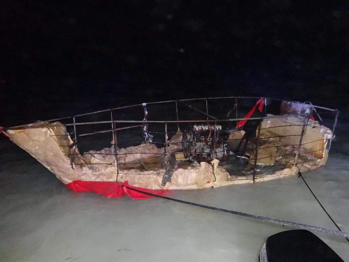 A homemade vessel sits on the shores of Sugarloaf Key in the Lower Florida Keys Thursday, March 31, 2022. One person on the boat was found dead. The six survivors said more from the group of Cuban migrants are missing.