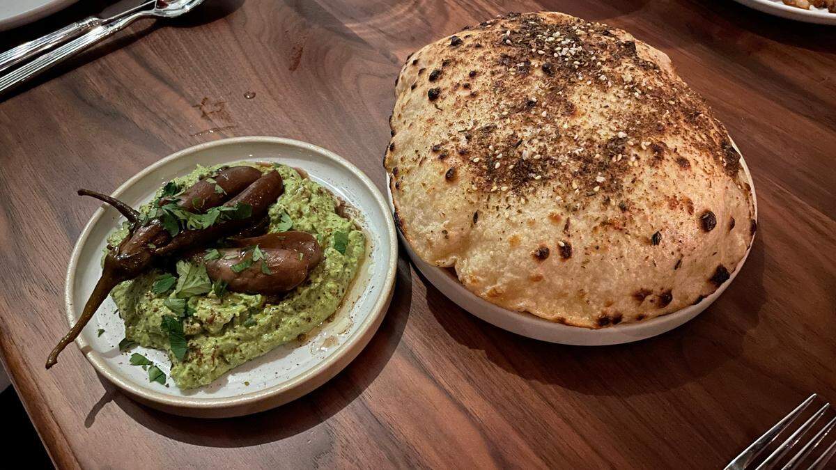 Hummus with housemade seasoned pita and marinated Japanese eggplants at Orno