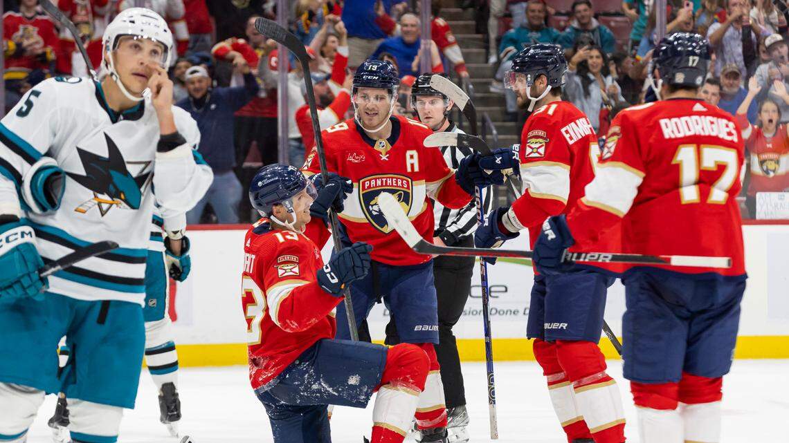 Florida Panthers center Sam Reinhart (13) celebrates with his teammates after scoring a goal against San Jose Sharks goaltender Mackenzie Blackwood (29) in the second period of their NHL game at the Amerant Bank Arena on Tuesday, Oct. 24, 2023, in Sunrise, Fla.