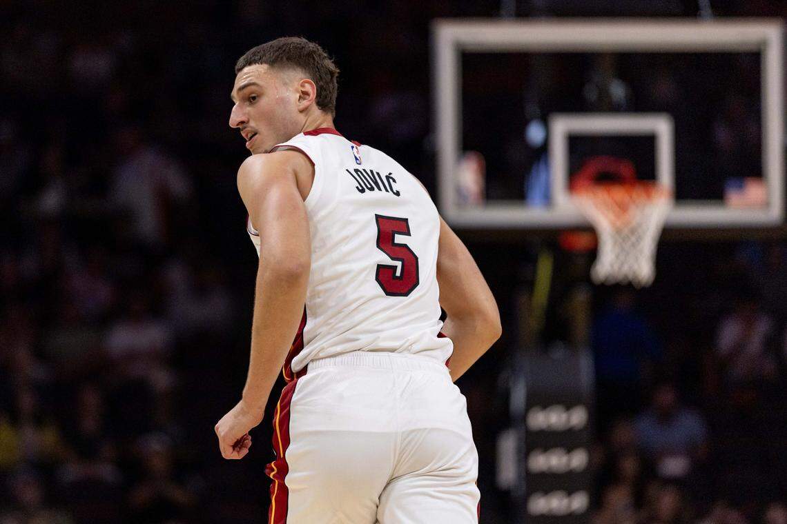 Miami Heat forward Nikola Jovic (5) reacts to hitting a shot during an NBA preseason game against the San Antonio Spurs at Kaseya Center on October 8, 2025, in Miami.