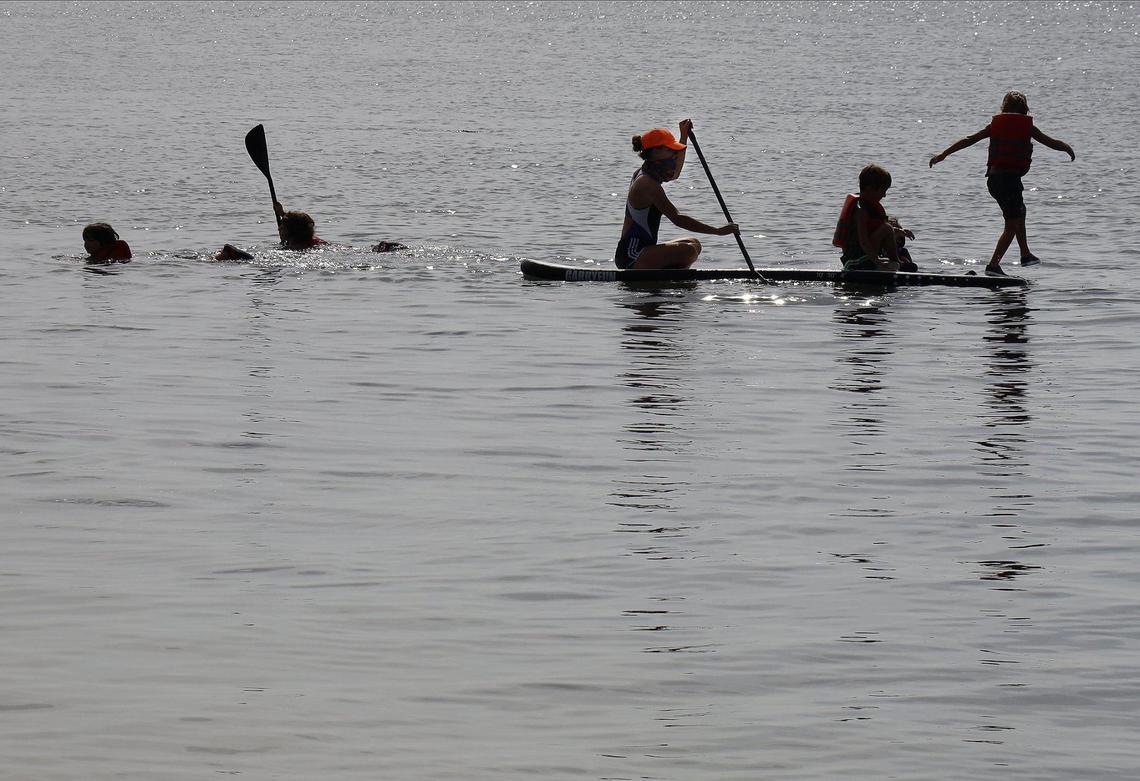 Young summer campers enjoy snorkeling and paddle boarding on the natural shoreline of the Historic Virginia Key Beach Park on Thursday, July 9, 2020. The park is celebrating its 75th Anniversary and is getting a historic day recognition on Aug. 1, 2020.