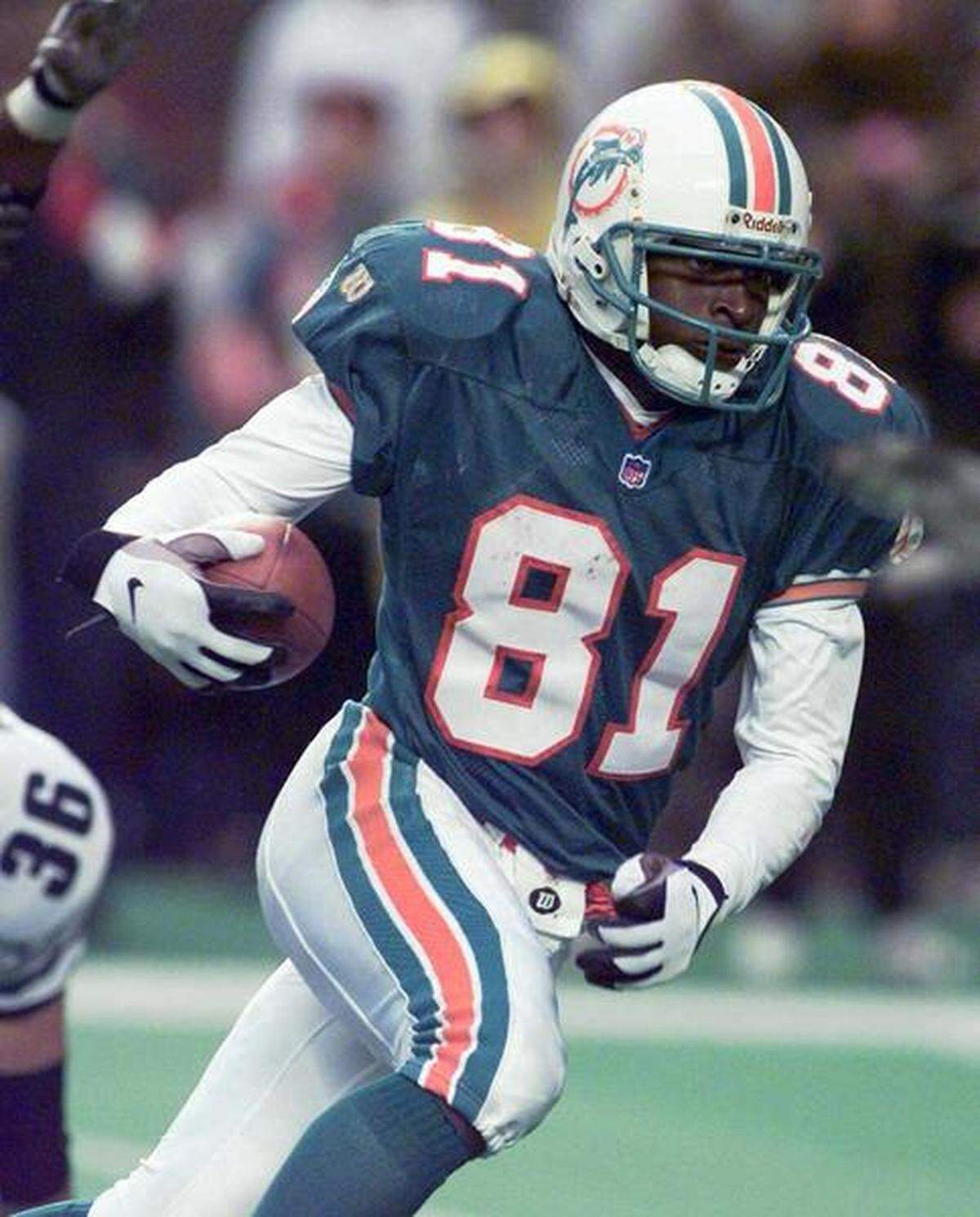 Former Dolphins receiver O.J. McDuffie is seen running the ball in this undated photo.