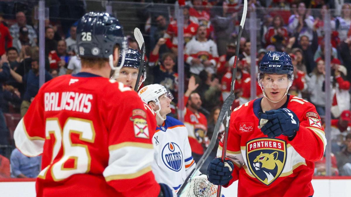 Florida Panthers center Anton Lundell (15) points to Florida Panthers defenseman Uvis Balinskis (26) after Balinskis scores a goal during the first period of a game against the Edmonton Oilers on Thursday, Feb. 27, 2025, at Amerant Bank Arena in Sunrise, Fla.