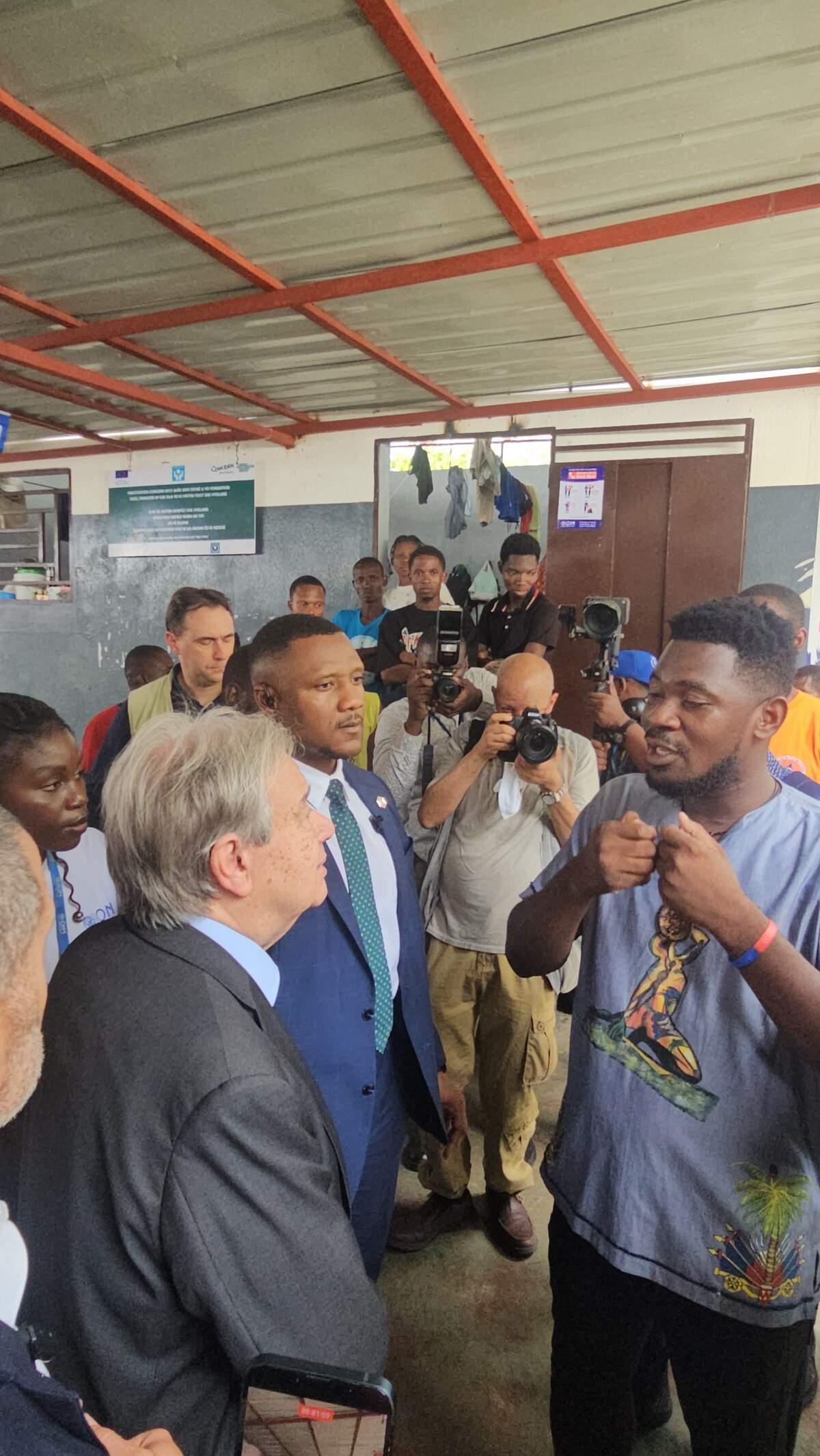 U.N. Secretary-General António Guterres speaks to Clifford Lala, 31, inside a displacement camp in Port-au-Prince on Tuesday, June 16, 2026.