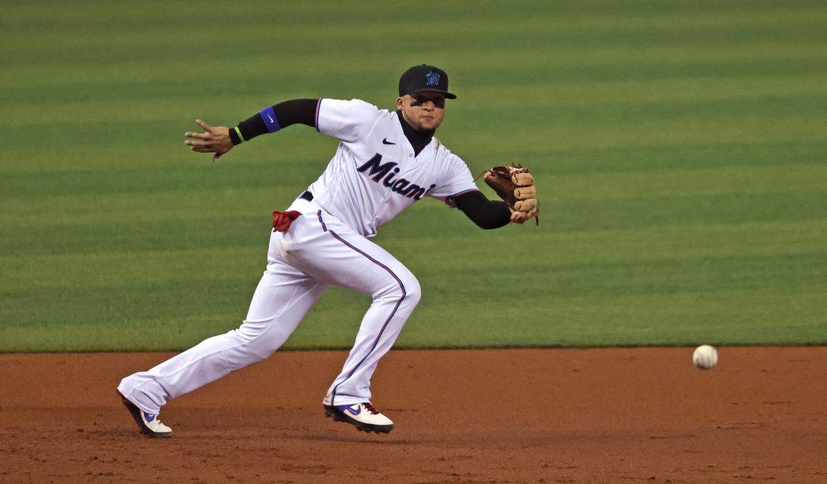 Miami Marlins third baseman Isan Diaz (1) unable to fields a ball hit by Colorado Rockies shortstop Brendan Rodgers (7) during the second inning of their baseball game at loanDepot park on Wednesday, June 9, 2021 in Miami, Florida.