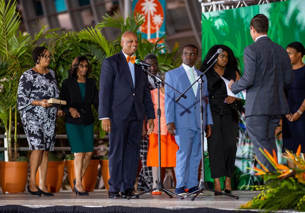 Oliver Gilbert reacts before taking the oath of office during his swearing-in ceremony as the new chair of the Miami-Dade County Commission at Hard Rock Stadium in Miami Gardens, Florida, on Thursday, Dec. 15, 2022.