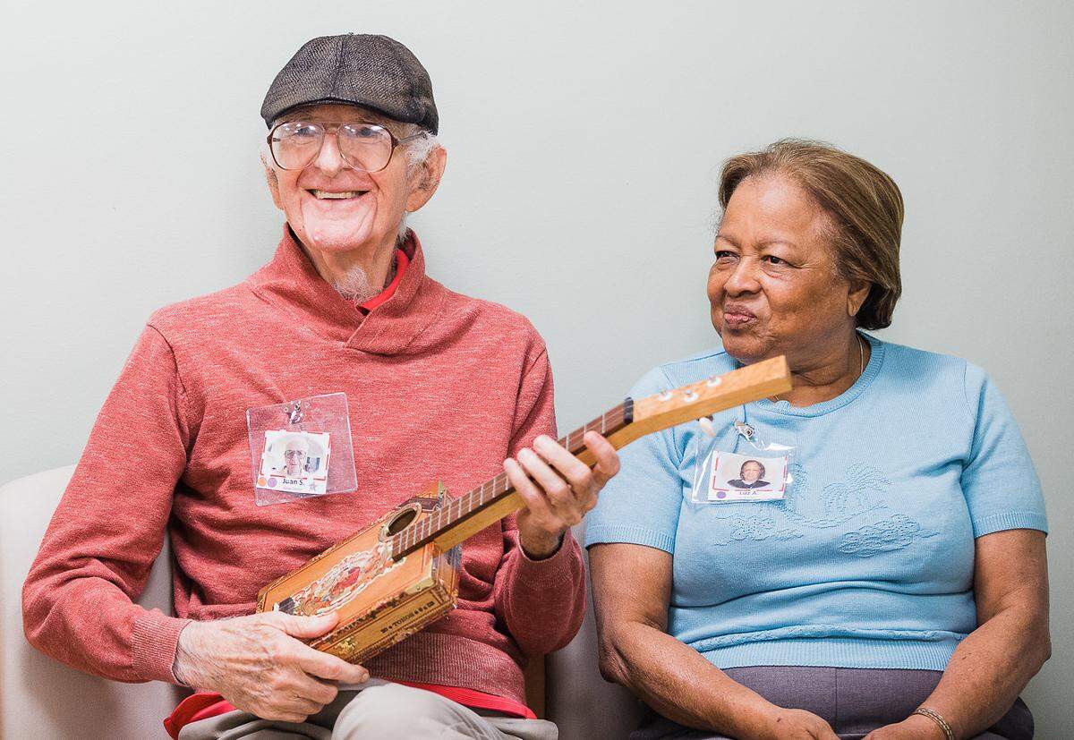 One of the program’s participants loves to play the cigar box guitar, which was handmade by a Mind & Melody team member.